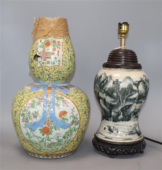A Chinese Kangxi period blue and white vase, converted to a lamp and a 19th century Chinese famille rose vase (a.f.) tallest 36cm